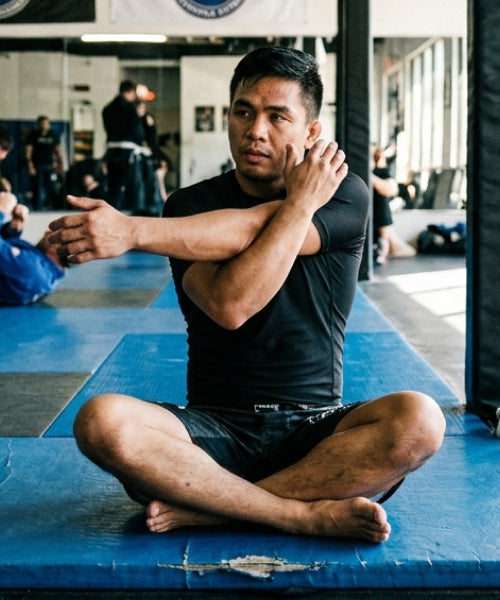 Man improving BJJ durability with Iron Neck